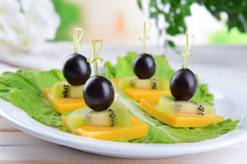 Delicious canapes on table close-up