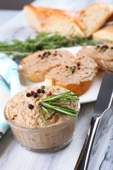 Fresh pate with bread on wooden table