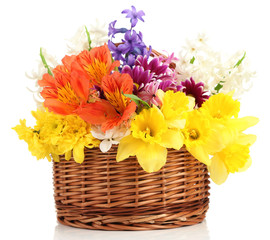 Beautiful flowers in wicker basket, isolated on white