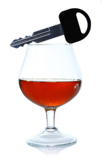 Composition with car key and glass of hard alcohol isolated