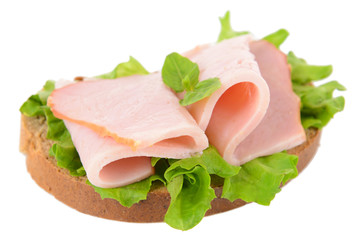 Delicious sandwich with lettuce and ham isolated on white