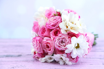 Beautiful wedding bouquet on table on bright background