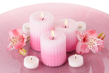 Fototapeta na wymiar Beautiful candles with flowers close-up