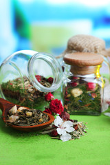 Assortment of herbs and tea in glass jars