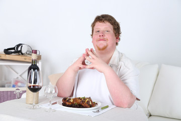 Tasty lunch for fat man, on home interior background