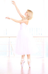 Beautiful balerina dancing in ballet class © Africa Studio