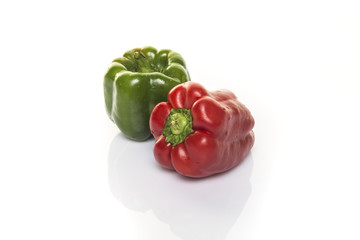 green and red bell peppers isolated on white background