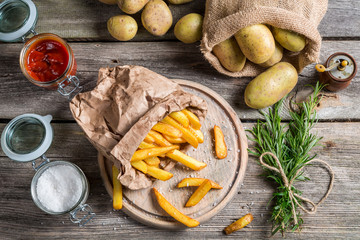 Fresh homemade fries with salt and ketchup