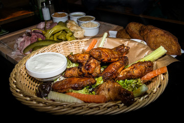 Grilled chicken wings in basket