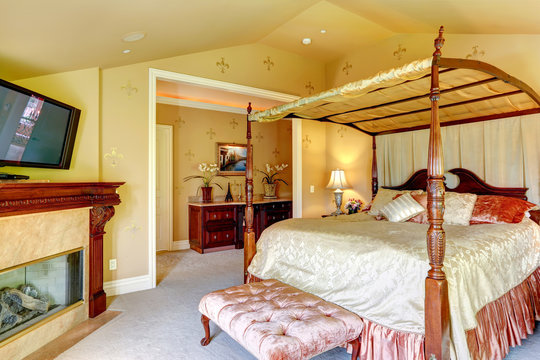 Luxury house interior. Beautiful bed with high posts