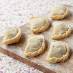 Uncooked dumplings with potatoes and mushrooms