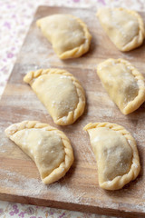 Uncooked dumplings with potatoes and mushrooms