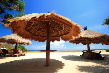 Fototapeta premium Thatched roof umbrella on beach