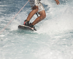 Closeup of wakeboarder on water