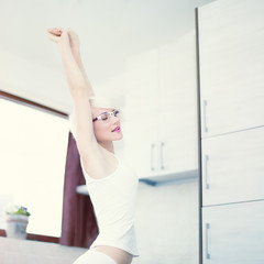 Beautiful girl  on the home kitchen