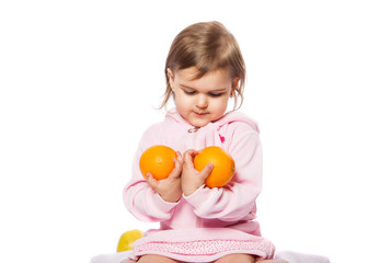 Fototapeta na wymiar little girl with oranges