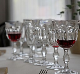 Bohemian crystal glasses lined up in set table
