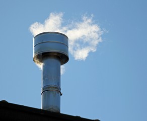 chimney on the roof with smoke