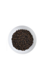 black pepper in on white cup in studio light