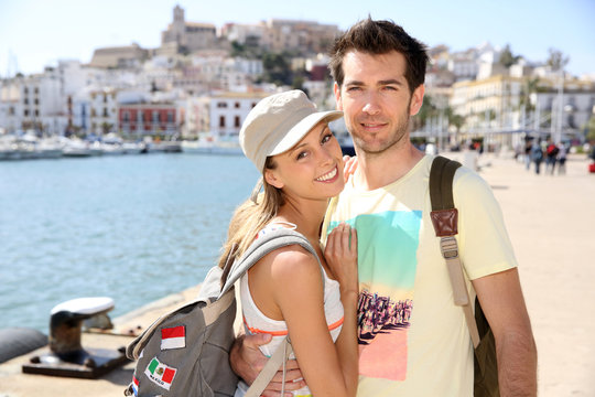 Cheerful couple of tourists visiting Ibiza