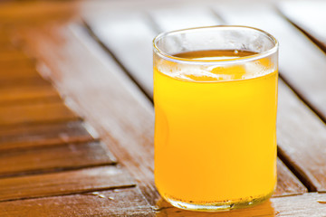 orange juice on wooden table