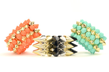 Close up on a three bracelets with spikes