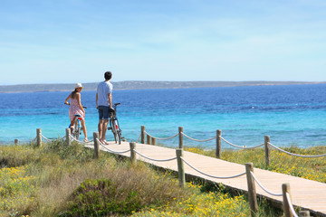 Couple riding bikes on Formentera Island