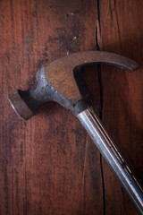 Top view of hammer on wood table