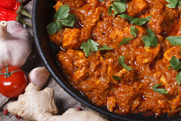 fillet of chicken in curry sauce top view macro
