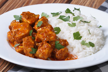 tasty fillet chicken curry with rice on a plate