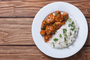 Rice with chicken in curry sauce top view