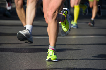 Marathon running race, people feet on road