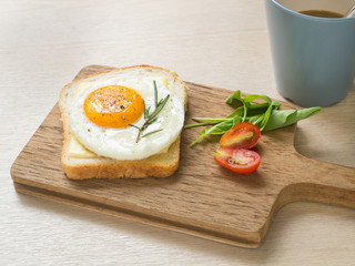 Breakfast ,Fried egg on the toast and cup of coffee