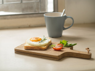 Breakfast ,Fried egg on the toast and cup of coffee