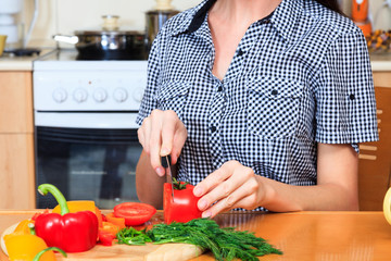 Woman prepares a salad