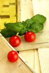 tomatoes and basil on a broken wooden box