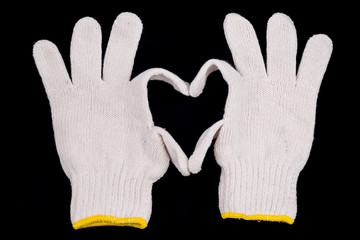 Symbol of heart by glove isolated on black.