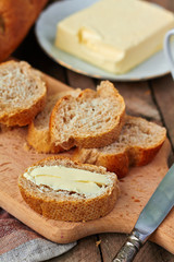 Sliced baguette with butter