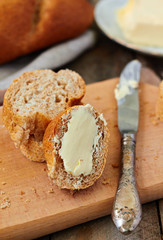 Sliced baguette with butter