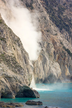big pieces of rocks falling into the sea
