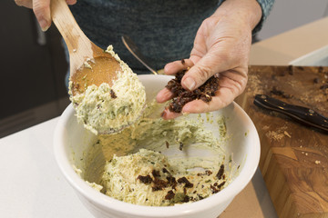 Making Pesto Crostini with Goat's Cheese and Sun Dried Tomatoes: