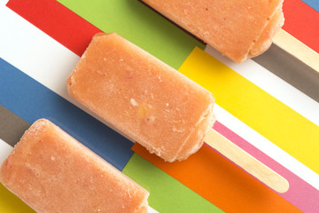 Strawberry, Orange, Pineapple, Mango Fruit Popsicles on Colorful