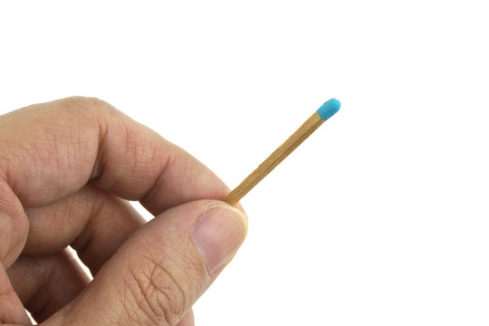 Hand hold blue matchstick for lit isolated
