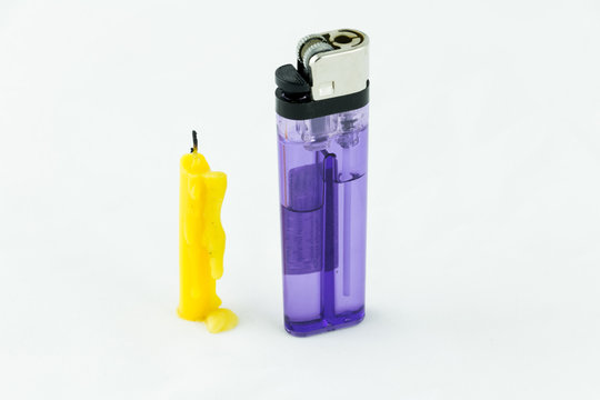 1 yellow candle  and 1 violet lighter on  isolated background