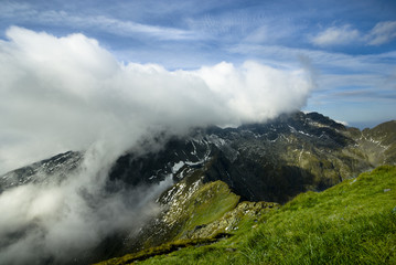Fototapeta na wymiar Hills covered with clouds