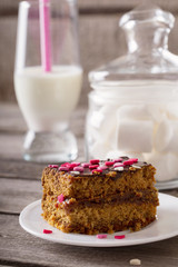 cake with hearts on wooden background