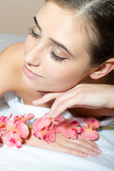 Obraz na płótnie Canvas Charming brunette takes a relaxing spa treatments