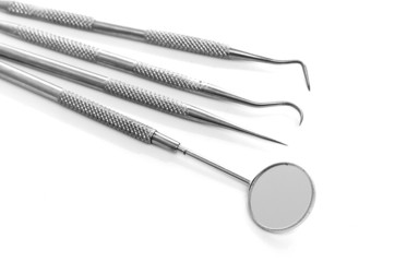 Basic dentist tools isolated on white