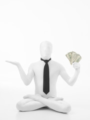 business man in lotus position with dollars