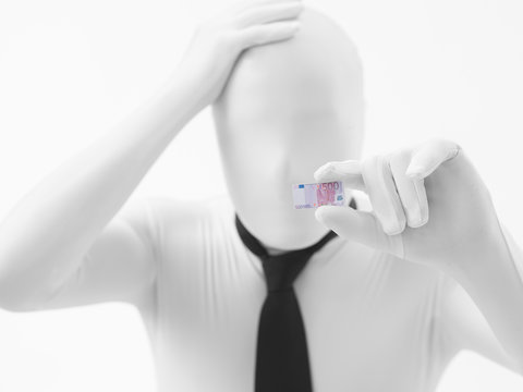 white man holding small euro bancnote